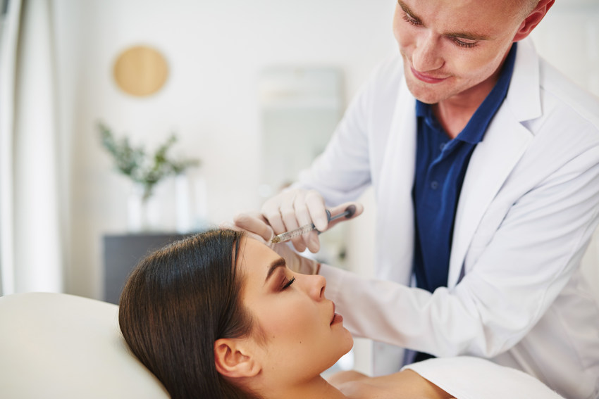 Doctor Injecting Botox Into A Female - Absolute Smile