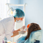 Young Woman Getting Dental Treatment Dental - Absolute Smile