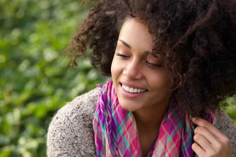 smiling woman with perfect teeth outdoors