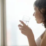 woman drinking glass of water