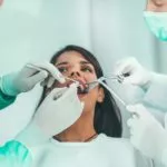 Dental examination with patient receiving professional care